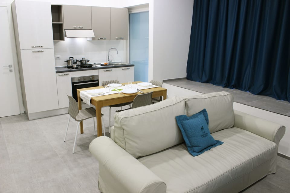 Apartment, 2 Bedrooms | Living room | Flat-screen TV