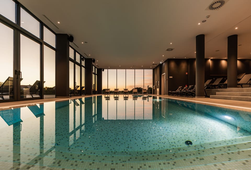 Indoor pool, outdoor pool, pool umbrellas, sun loungers