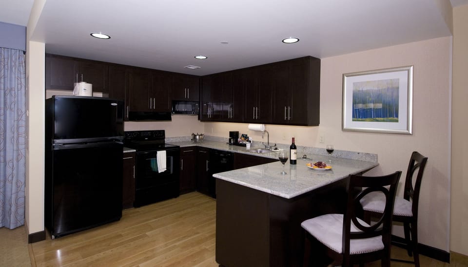 Presidential Two King and One Sofa Bed Non-Smoking | Private kitchen | Full-size fridge, microwave, stovetop, dishwasher