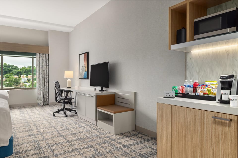 Room, 2 Queen Beds (Drinks & Snacks) | In-room safe, laptop workspace, blackout drapes, iron/ironing board