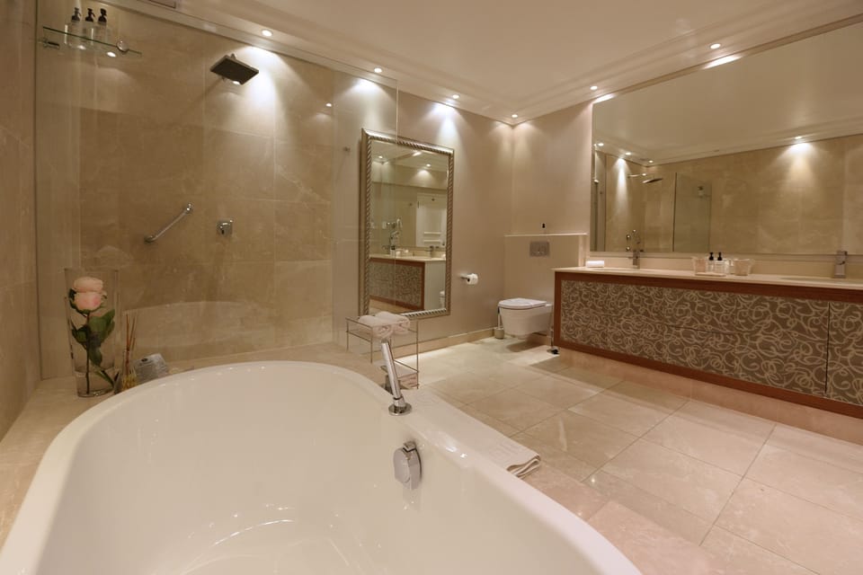 Superior Suite | Bathroom | Separate tub and shower, designer toiletries, hair dryer, bathrobes