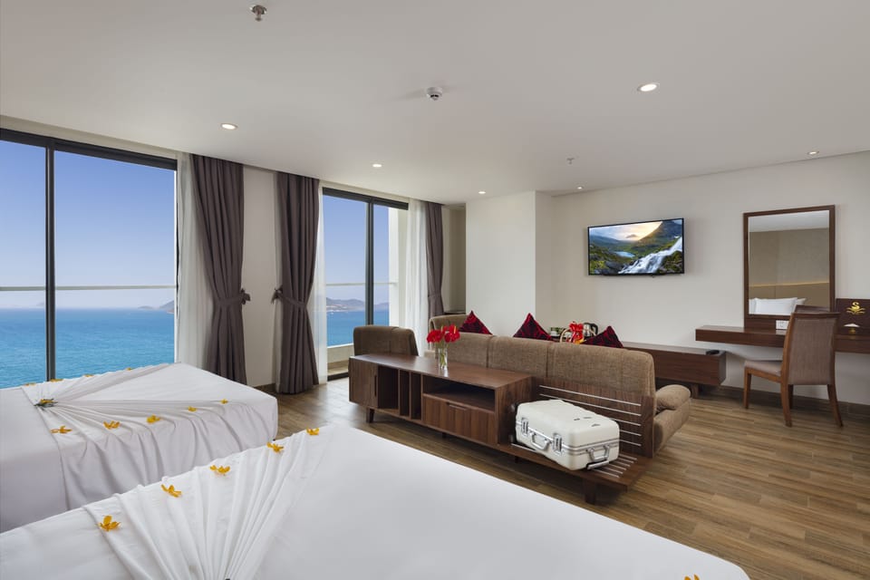 Family Room, Balcony, Sea View | Minibar, in-room safe, desk, blackout drapes