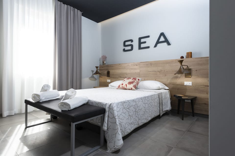 Standard Double Room | Minibar, individually furnished, desk, blackout drapes