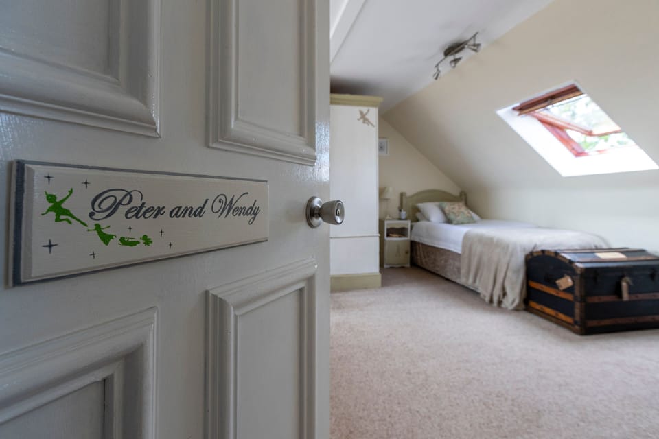 Family Triple Room, Multiple Beds, Non Smoking | Individually decorated, individually furnished, iron/ironing board