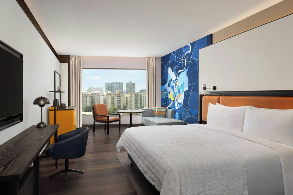 Executive Studio, 1 King Bed, City View | Premium bedding, minibar, in-room safe, individually furnished