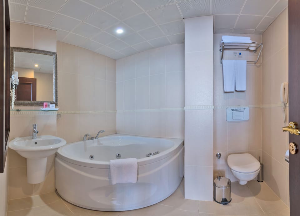 Suite, Sea View | Bathroom | Shower, designer toiletries, hair dryer, slippers