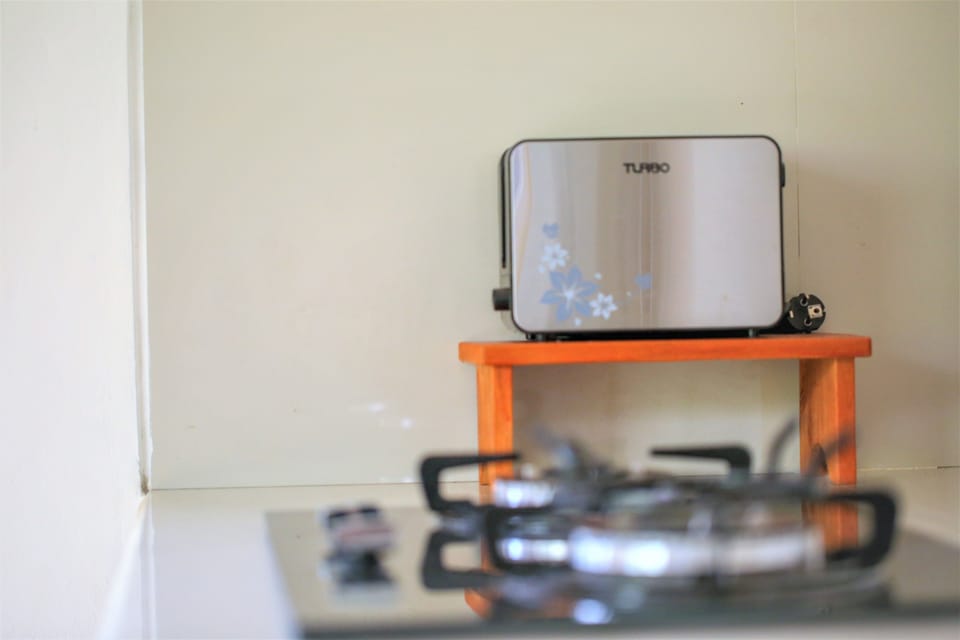 Fridge, coffee/tea maker, electric kettle, cleaning supplies