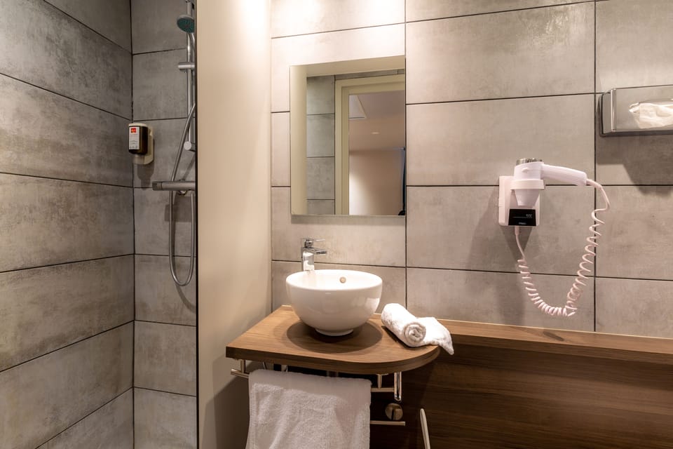 Economy Double Room (access by stairs, no elevator) | Bathroom amenities | Shower, hair dryer, towels