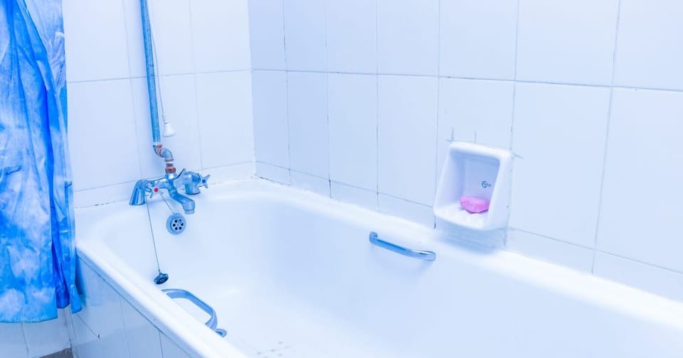 Deluxe Apartment, 3 Bedrooms | Bathroom | Combined shower/tub, deep soaking tub, slippers, towels