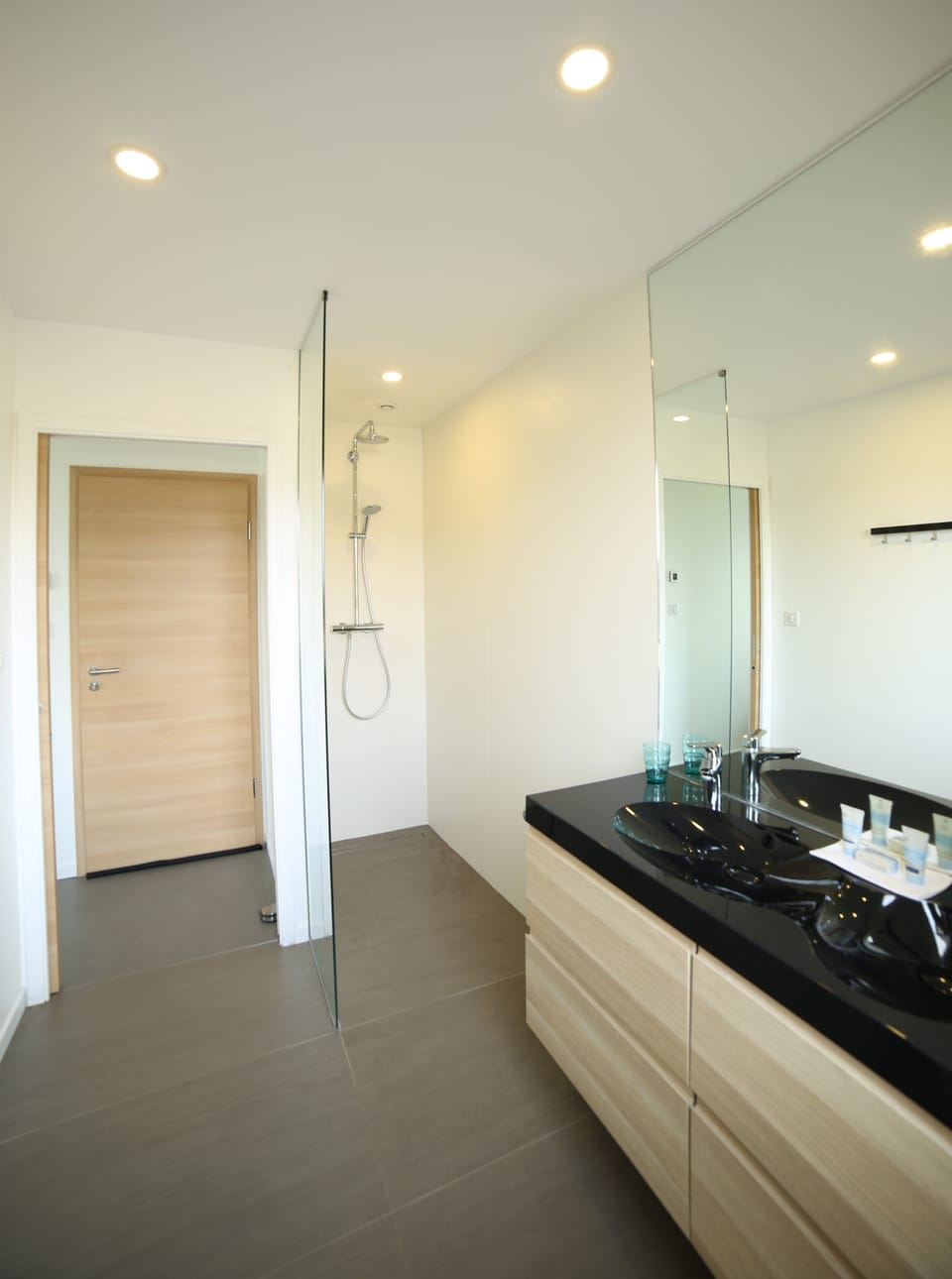 Shower, rainfall showerhead, hair dryer, towels