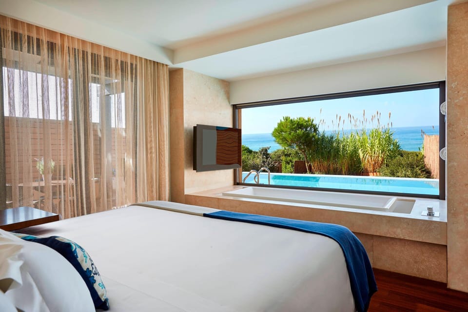 Grand Suite, 1 Bedroom, Beachfront | Minibar, in-room safe, desk, blackout drapes