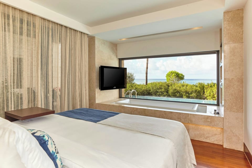 Premium Grand Infinity Suite, 1 Bedroom, Non Smoking, Sea front | Minibar, in-room safe, desk, blackout drapes