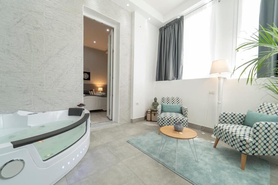 Exclusive Room | Living area | Flat-screen TV