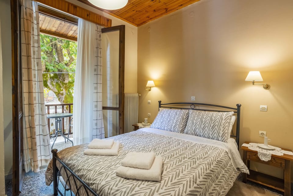 Economy Double Room | Down comforters, pillowtop beds, blackout drapes, iron/ironing board