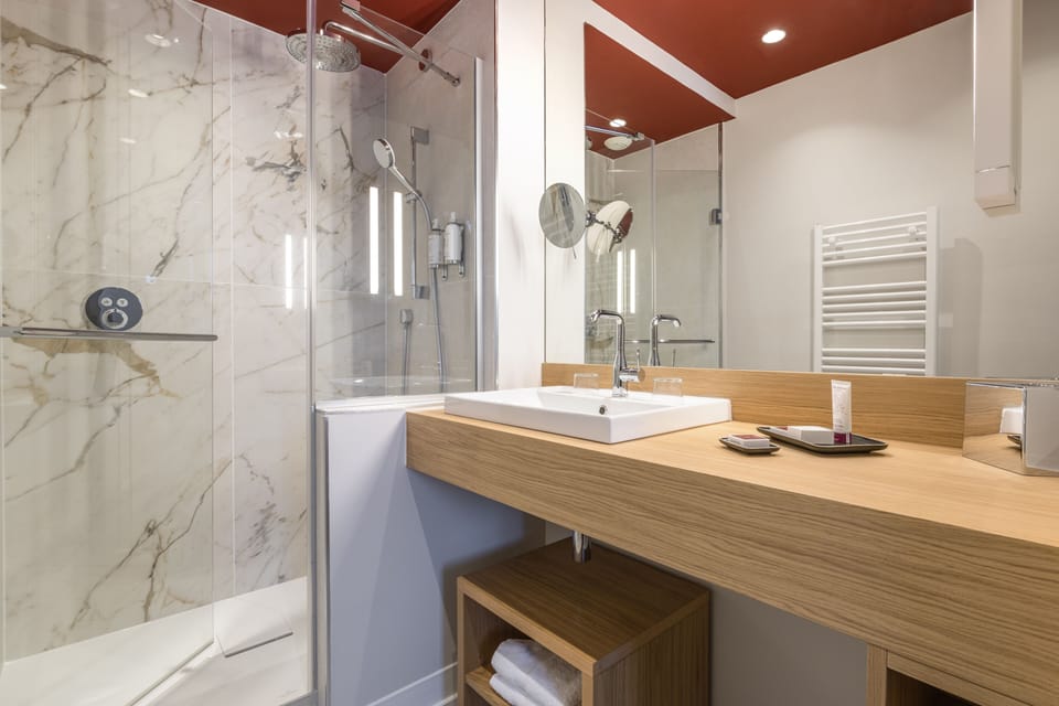Superior Room | Bathroom | Hair dryer, towels, soap, shampoo