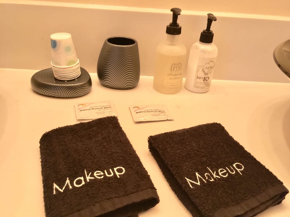 Shower, rainfall showerhead, designer toiletries, hair dryer