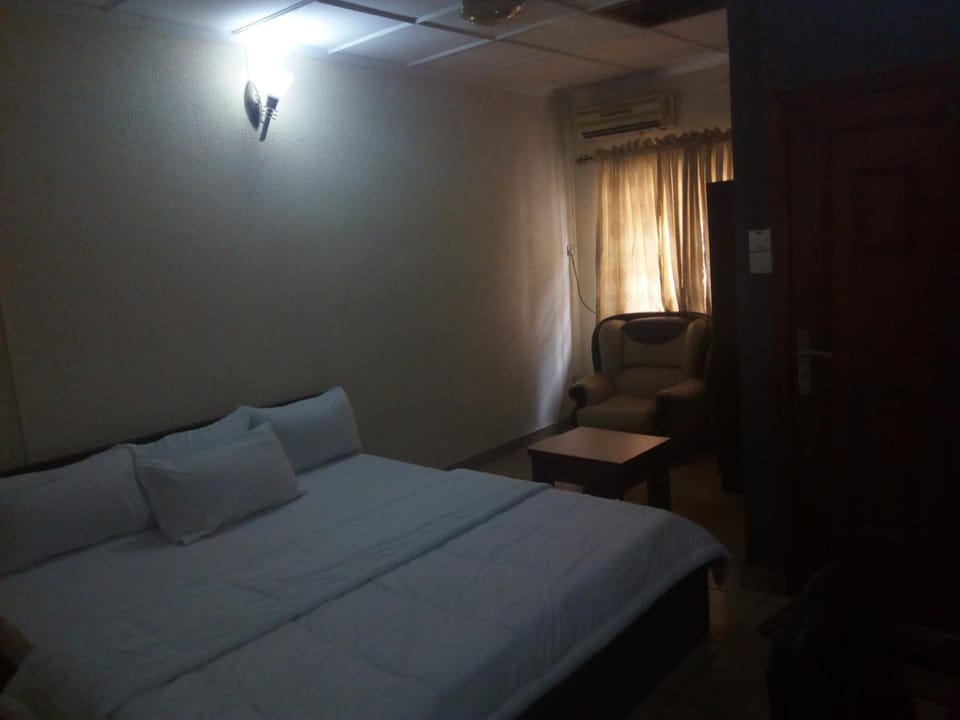 Desk, laptop workspace, bed sheets