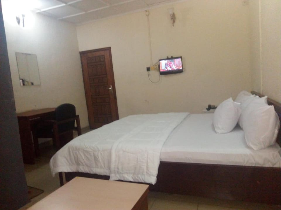 Desk, laptop workspace, bed sheets
