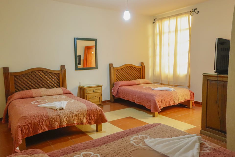Down comforters, blackout drapes, iron/ironing board (on request)
