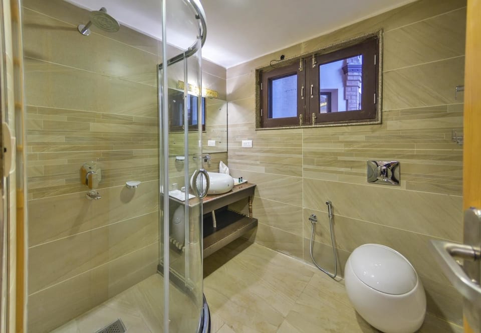 Shower, free toiletries, slippers, towels
