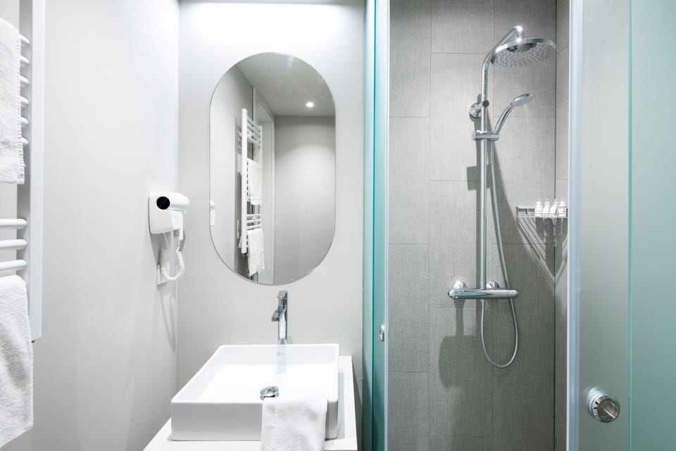 Shower, free toiletries, hair dryer, slippers