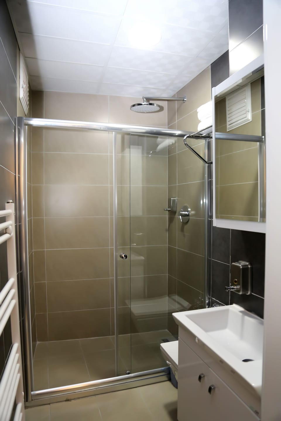 Shower, free toiletries, hair dryer, slippers