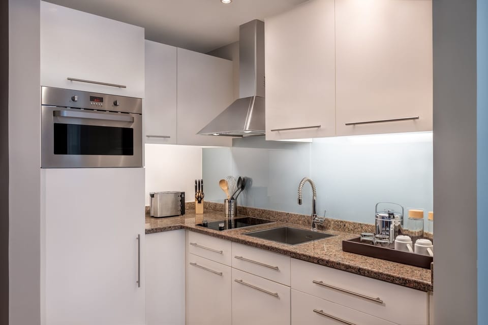 1 King Studio Suite Accessible Theme Park Access | Private kitchen | Coffee/tea maker, full-size fridge, microwave, oven