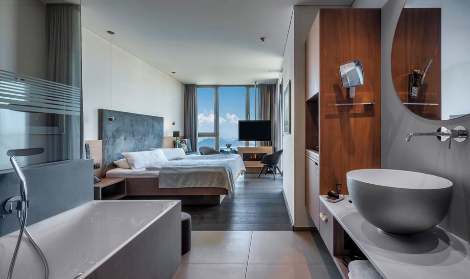 Design Lounge PANORAMA, Balcony | Bathroom | Deep soaking tub, rainfall showerhead, free toiletries, hair dryer