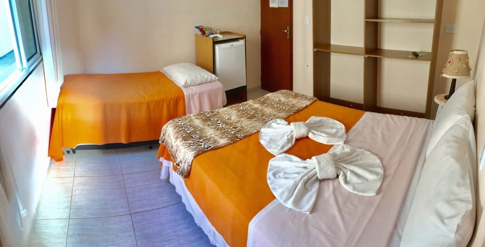 Quarto Standard com Ar Condicionado | Minibar, blackout drapes, free WiFi