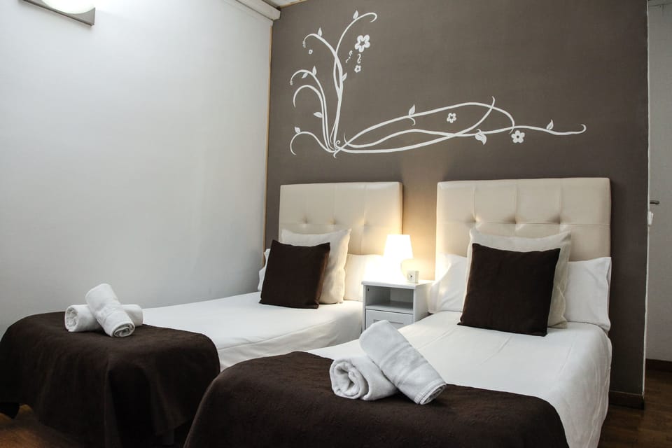 Double Room, Private Bathroom (Exterior Bathroom) | Minibar, iron/ironing board, free WiFi, bed sheets