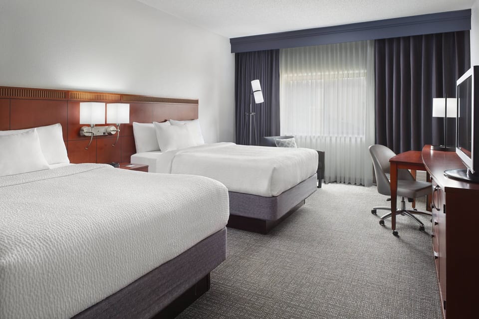 Premium bedding, desk, laptop workspace, iron/ironing board