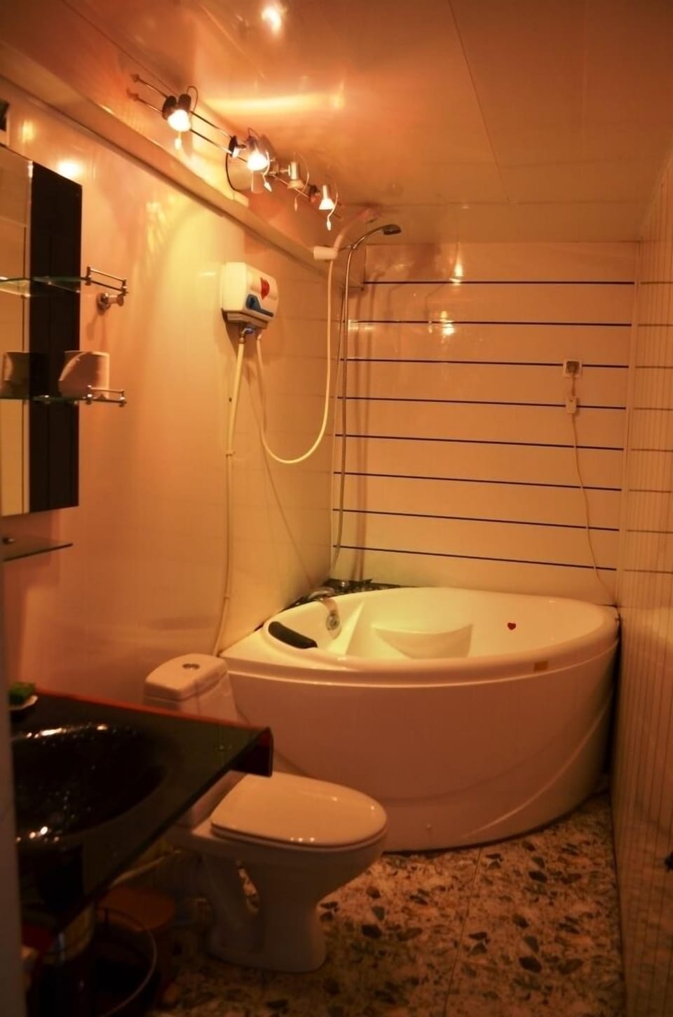 Family Triple Room | Bathroom | Shower, free toiletries, hair dryer, slippers