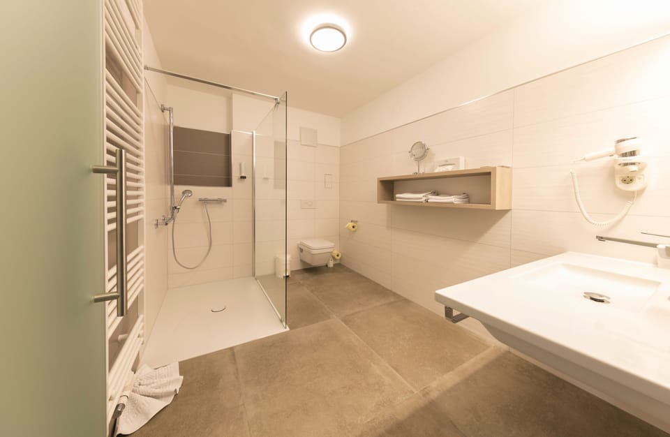 Eco-friendly toiletries, hair dryer, bathrobes, slippers