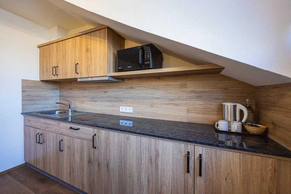 Hotel Apartment | Private kitchen | Electric kettle, highchair