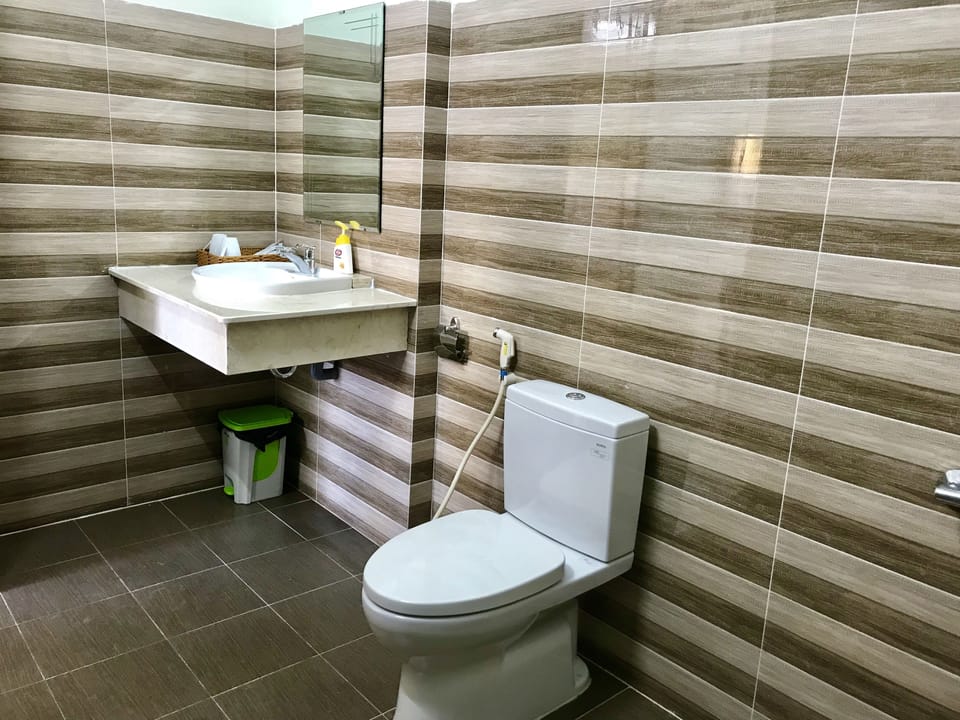 Shower, free toiletries, hair dryer, slippers