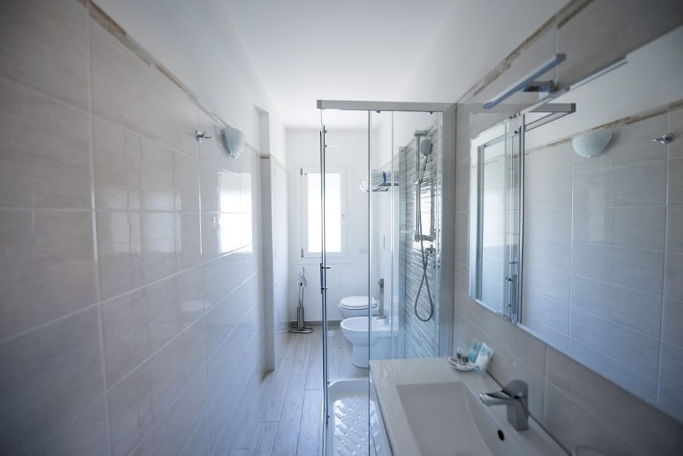 Double Room, Pool View | Bathroom | Shower, hair dryer, slippers, bidet
