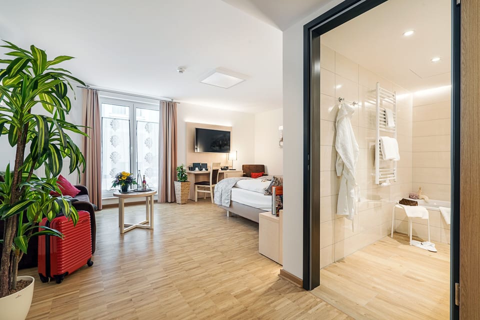 Grand Double Room | Living area | Flat-screen TV