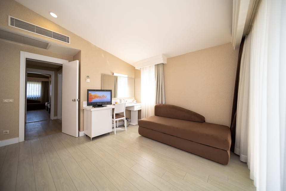 Room Pool View Lakeside | Living area | 32-inch LCD TV with satellite channels, TV