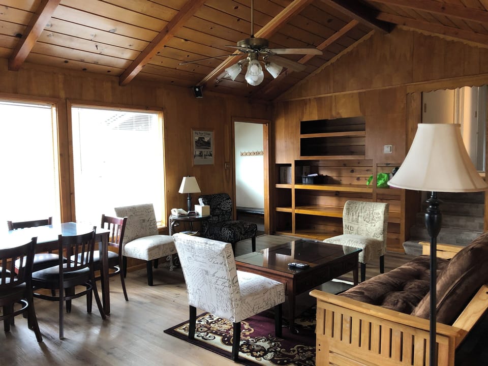 Deluxe Room, Multiple Beds | Living area | 42-inch flat-screen TV with satellite channels, TV