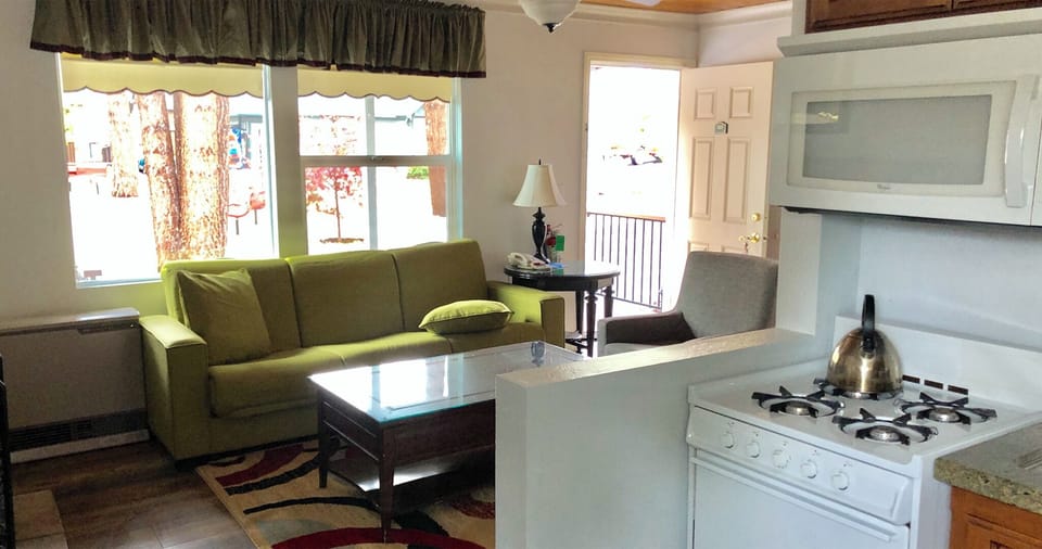 Deluxe Room, 2 Queen Beds, Kitchen | Living area | 42-inch flat-screen TV with satellite channels, TV