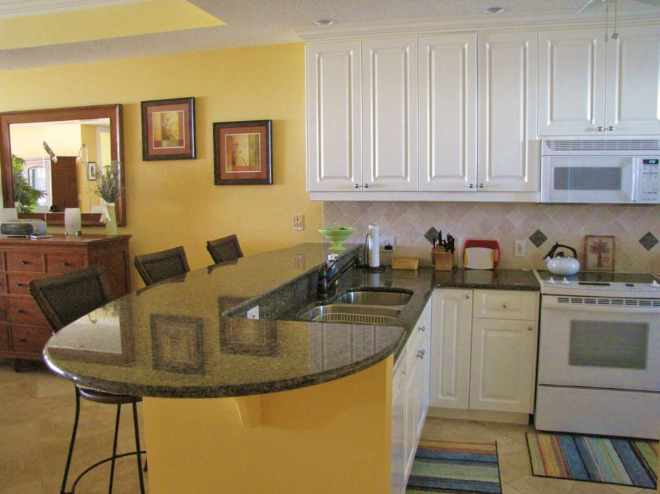 Condo, 2 Bedrooms, Ocean View, Beachfront | Private kitchen | Coffee/tea maker, full-size fridge, microwave, oven