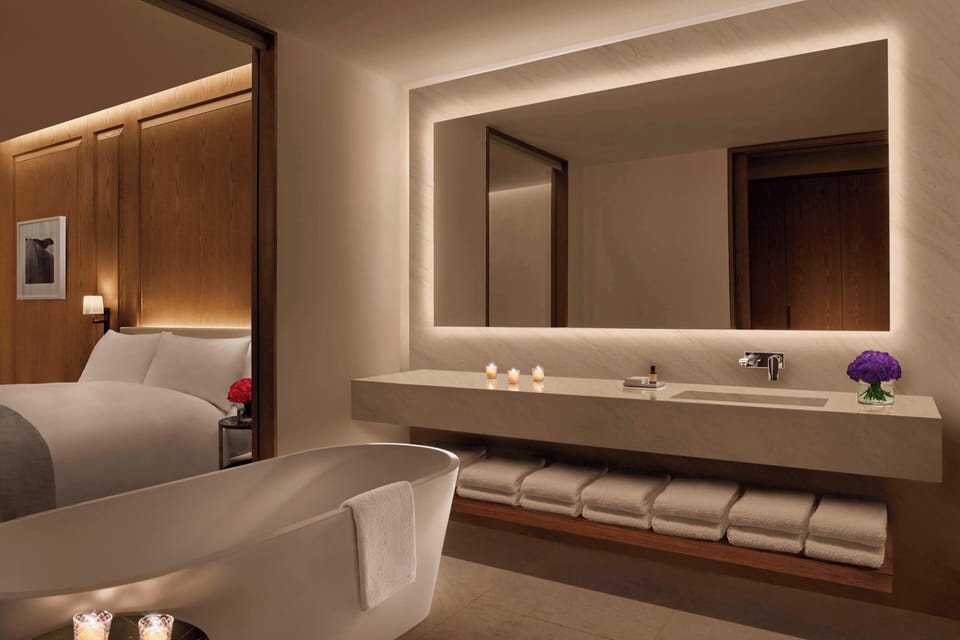 Separate tub and shower, designer toiletries, hair dryer, bathrobes