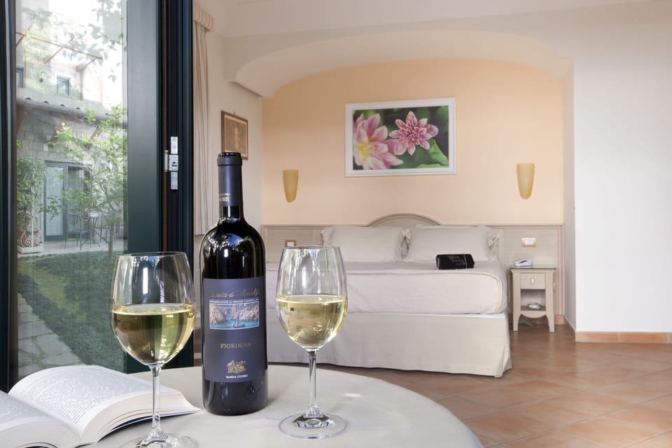 Deluxe Room | Down comforters, memory foam beds, minibar, in-room safe