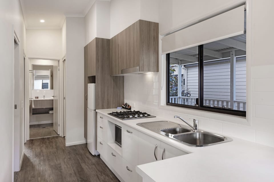 Superior 2 Bedroom Cabin | Private kitchen | Electric kettle, dining table