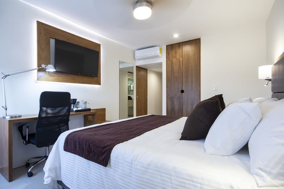 Down comforters, pillowtop beds, in-room safe, desk