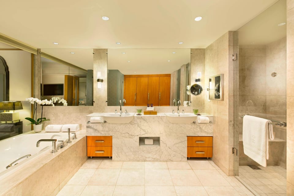 Executive Suite, 1 King Bed | Bathroom | Separate tub and shower, deep soaking tub, rainfall showerhead
