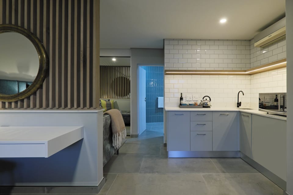 Garden Suite | Private kitchenette | Microwave, coffee/tea maker, electric kettle, highchair