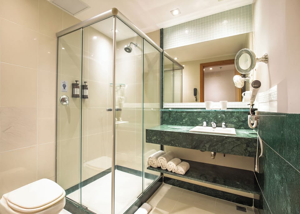 Suite, Sea View | Bathroom | Shower, rainfall showerhead, hair dryer, towels