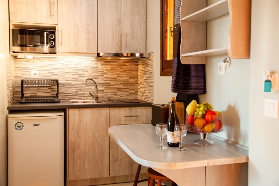 Apartment, 2 Bedrooms | Private kitchenette | Fridge, microwave, stovetop, coffee/tea maker