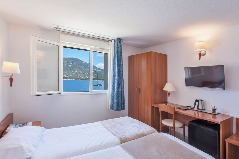Twin Room, Sea View | Blackout drapes, soundproofing, iron/ironing board, free WiFi
